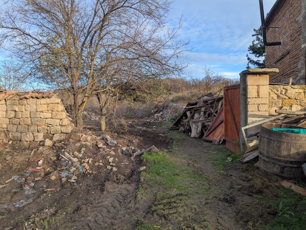 Cleared passage beside remaining structures after demolition cleanup